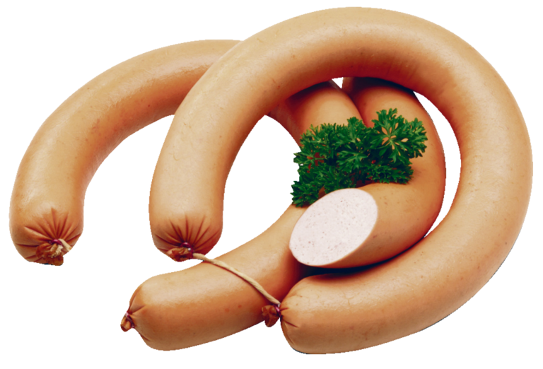 Zu sehen sind zwei runde Fleischwurst Ringe mit glänzender orangefarbener Haut. Einer der Fleischwurst Ringe ist bereits angeschnitten. Etwas Petersilie liegt als Dekoration auf den Ringen. Auch als salzreduzierte Variante verfügbar.
