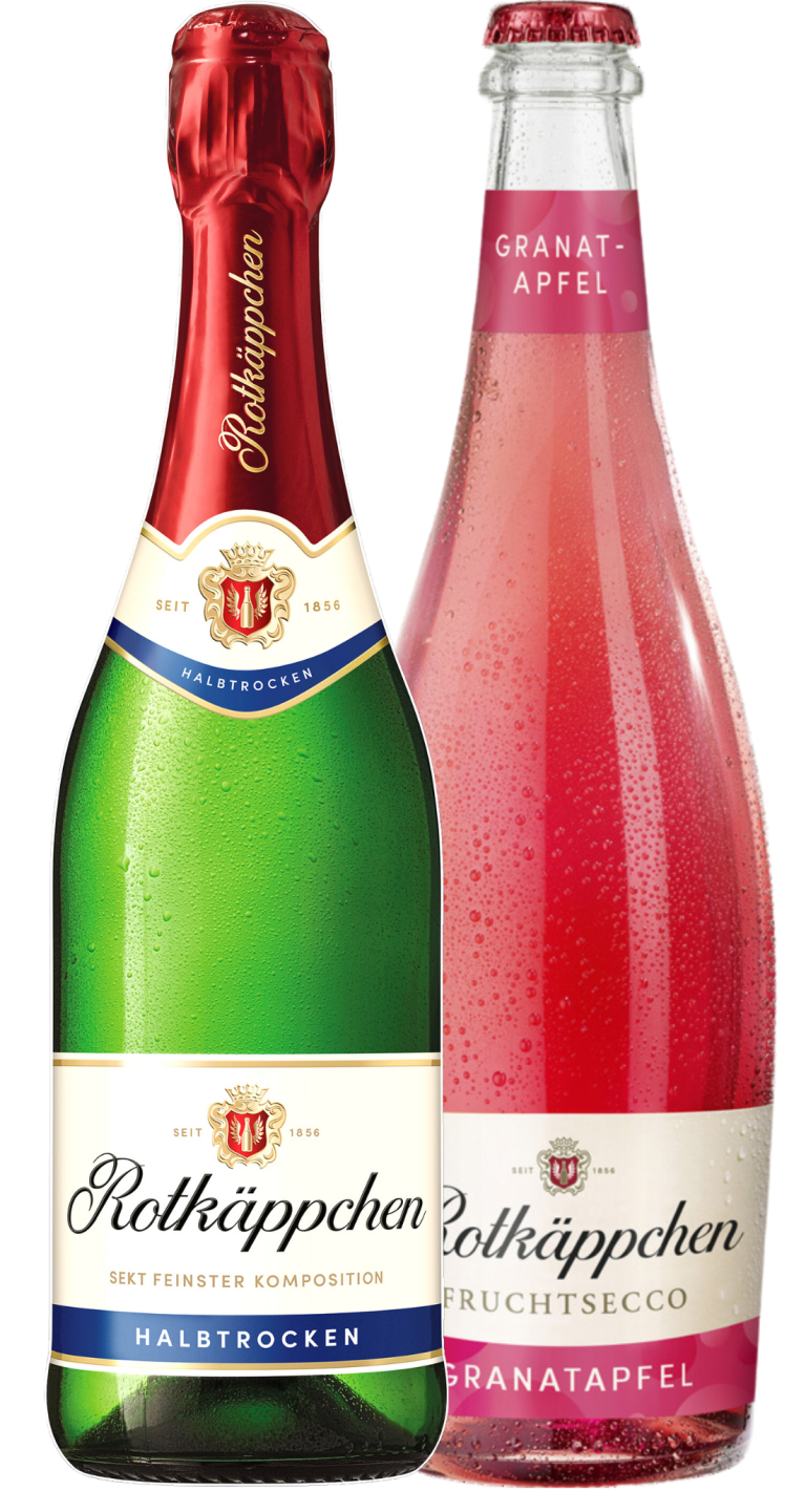 Zu sehen ist eine Glasflasche Sekt und eine Glasflasche Secco der Marke Rotkäppchen je 0,75 Liter. Die linke grüne Flasche hat ein beiges Etikett mit der Aufschrift "Rotkäppchen Sekt feinster Komposition Halbtrocken". Der Deckel und Flaschenhals sind ummantelt von einer roten Folie, auf der in querer Schrift "Rotkäppchen" geschrieben steht. Die rechte Flasche mit roter Flüssigkeit hat ein beiges Etikett mit der Aufschrift "Rotkäppchen Fruchtsecco Granatapfel". Am Flaschenhals ist ein pinkes Etikett auf dem "Granatapfel" steht.